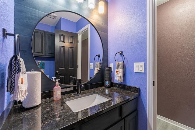 1408 Eagle Dr, Moore, OK 73160 - bathroom featuring vanity and a textured wall