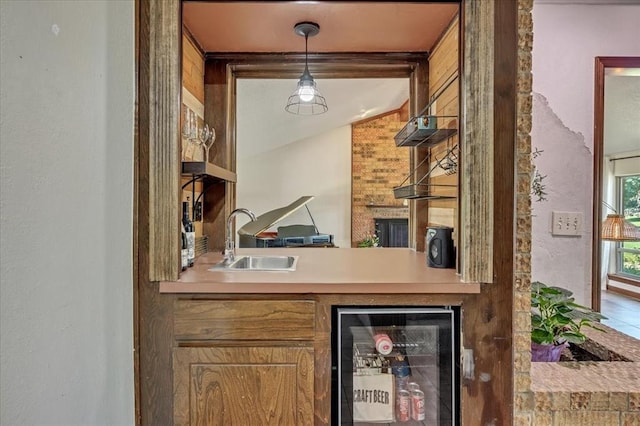 2122 Edinburg Dr, Yukon, OK 73099 - bar featuring wine cooler and hanging light fixtures