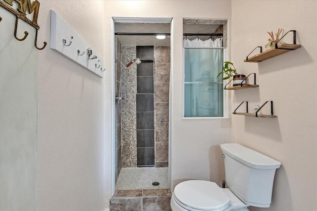 2122 Edinburg Dr, Yukon, OK 73099 - full bathroom featuring toilet and tiled shower