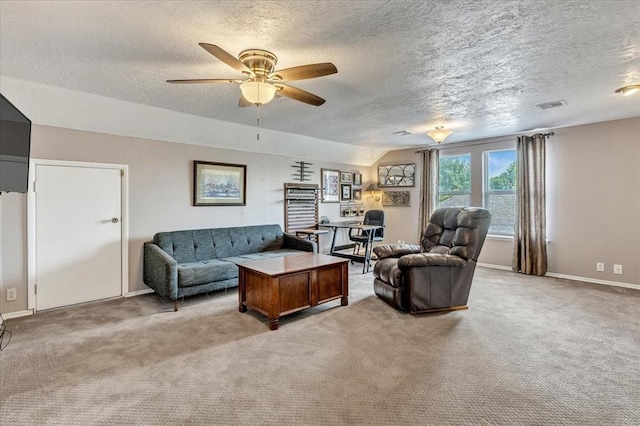 2122 Edinburg Dr, Yukon, OK 73099 - living room with carpet, a textured ceiling, a ceiling fan, and a desk