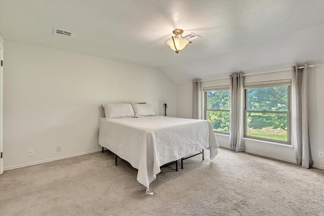 2122 Edinburg Dr, Yukon, OK 73099 - carpeted bedroom with lofted ceiling and baseboards