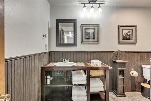 2122 Edinburg Dr, Yukon, OK 73099 - bathroom with vanity and a wainscoted wall