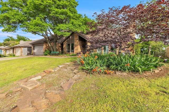 2122 Edinburg Dr, Yukon, OK 73099 - view of front facade featuring a garage, a front yard, and concrete driveway