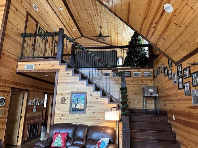 36 Spruce Ct, Broken Bow, OK 74728 - stairway featuring high vaulted ceiling, wooden walls, a ceiling fan, and wooden ceiling