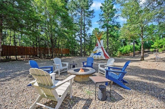 36 Spruce Ct, Broken Bow, OK 74728 - view of yard with a fire pit and view of wooded area