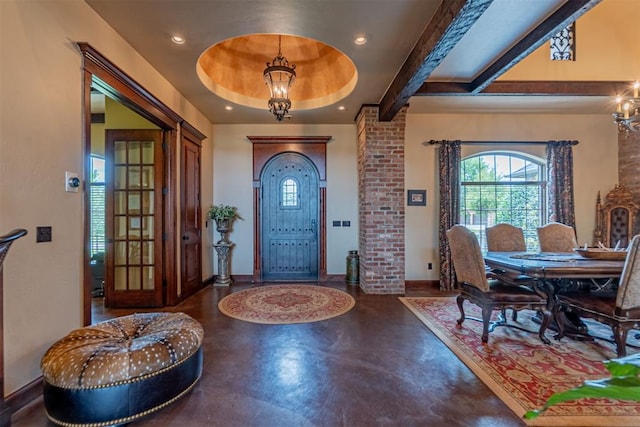 1505 SW 113th Pl, Oklahoma City, OK 73170 - foyer entrance featuring concrete floors, healthy amount of natural light, recessed lighting, ornate columns, and a chandelier