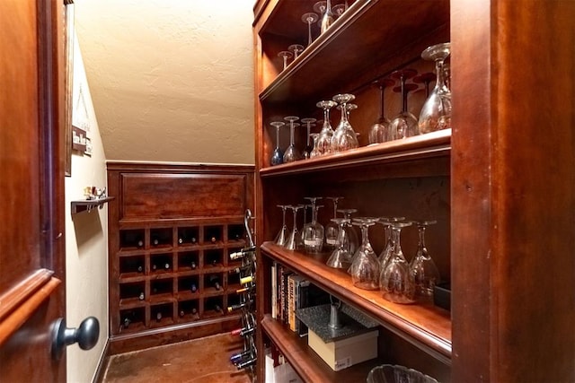 1505 SW 113th Pl, Oklahoma City, OK 73170 - wine area featuring a textured wall and wainscoting