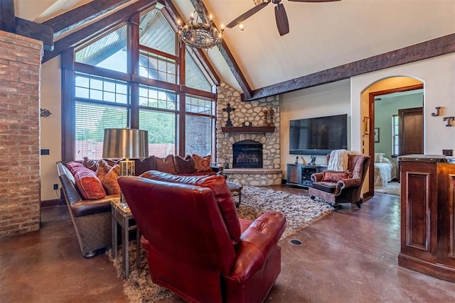 1505 SW 113th Pl, Oklahoma City, OK 73170 - living area featuring finished concrete floors, high vaulted ceiling, a ceiling fan, beam ceiling, and a stone fireplace