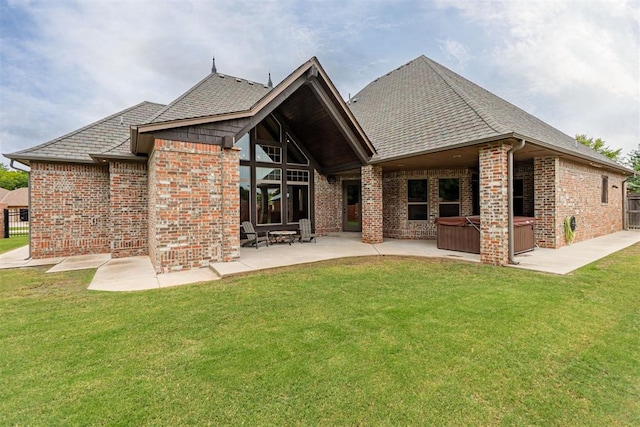 1505 SW 113th Pl, Oklahoma City, OK 73170 - rear view of house with a hot tub, a patio area, brick siding, and a shingled roof