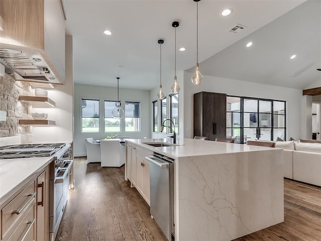 2917 Piazza Ct, Arcadia, OK 73007 - kitchen featuring stainless steel appliances, ventilation hood, dark wood-style flooring, open floor plan, and recessed lighting