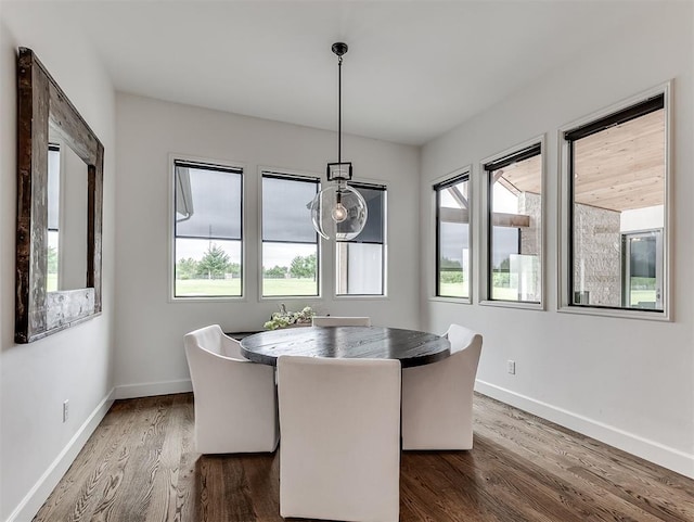 2917 Piazza Ct, Arcadia, OK 73007 - dining space featuring baseboards and dark wood finished floors