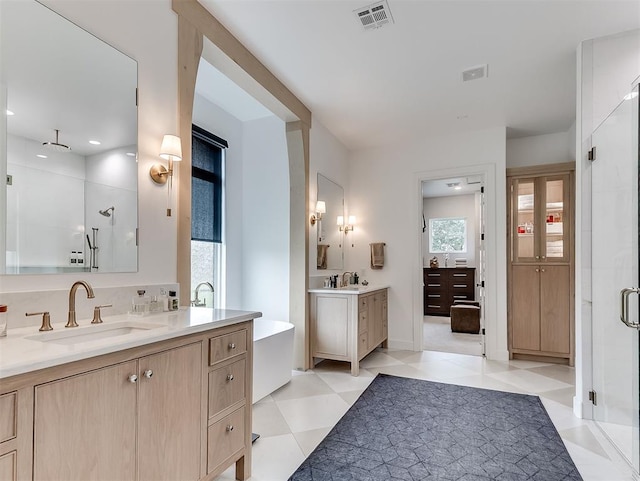 2917 Piazza Ct, Arcadia, OK 73007 - full bath with a stall shower, two vanities, and a freestanding tub
