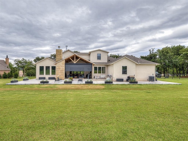 2917 Piazza Ct, Arcadia, OK 73007 - back of house with a patio area, stucco siding, a lawn, and a chimney