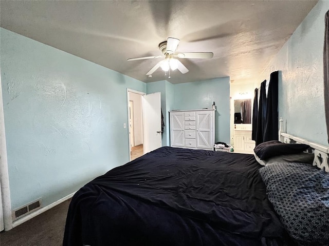 6338 Norman Rd, Warr Acres, OK 73122 - bedroom with carpet, a ceiling fan, and ensuite bath