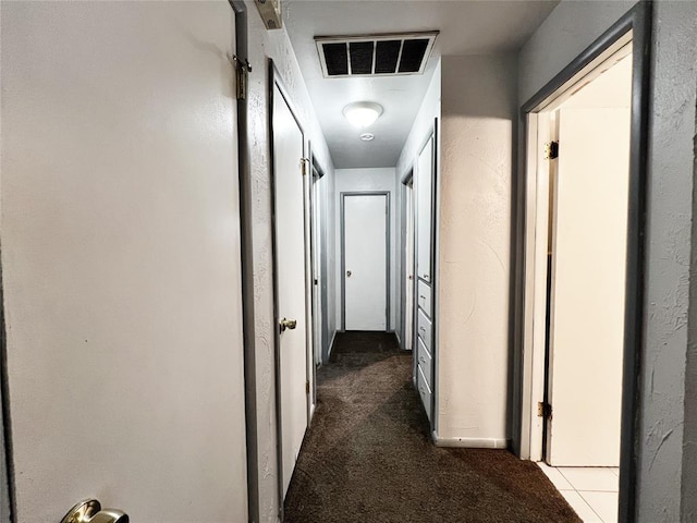 6338 Norman Rd, Warr Acres, OK 73122 - corridor featuring dark colored carpet