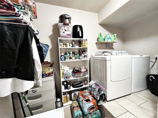 6338 Norman Rd, Warr Acres, OK 73122 - washroom featuring separate washer and dryer and light tile patterned floors