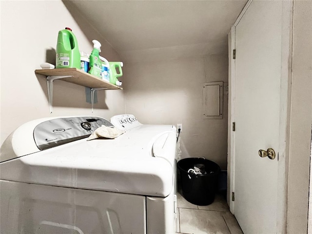 6338 Norman Rd, Warr Acres, OK 73122 - laundry area with washer and dryer and light tile patterned floors