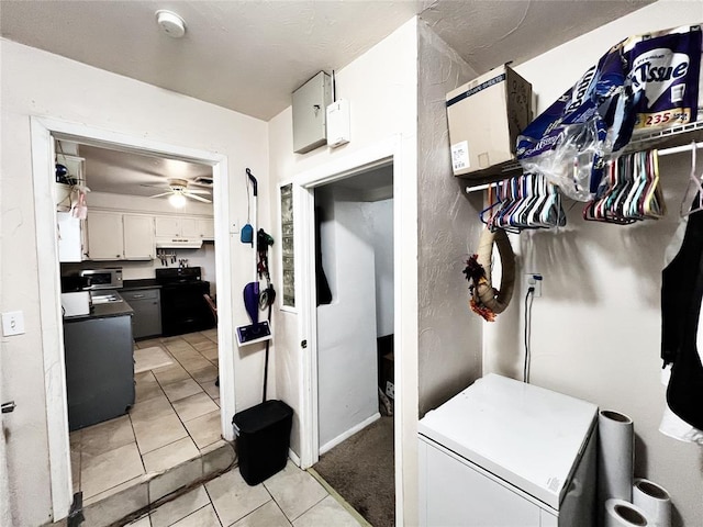 6338 Norman Rd, Warr Acres, OK 73122 - kitchen featuring fridge, light tile patterned floors, white cabinets, ceiling fan, and dark countertops