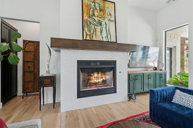 4504 SE 41st St, Moore, OK 73165 - living room with light wood-type flooring and a tile fireplace