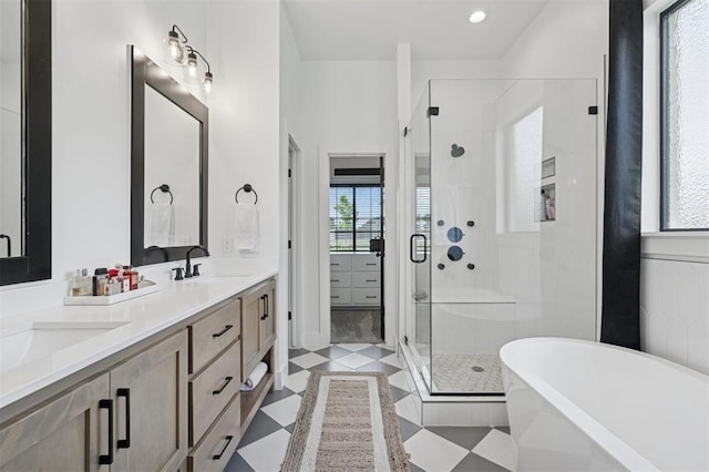 4504 SE 41st St, Moore, OK 73165 - bathroom with a stall shower, double vanity, a soaking tub, and plenty of natural light
