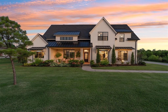 4504 SE 41st St, Moore, OK 73165 - modern farmhouse style home featuring a standing seam roof, a lawn, and a metal roof
