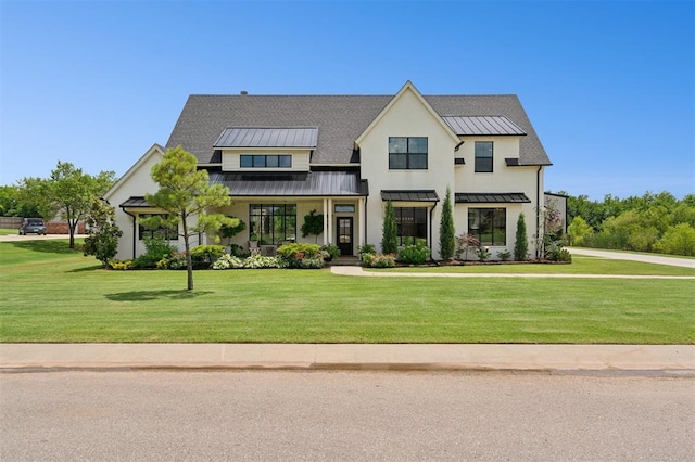 4504 SE 41st St, Moore, OK 73165 - modern farmhouse with a standing seam roof, a front lawn, and a metal roof