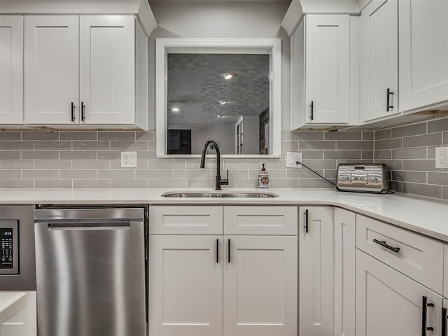 10505 Lyndon Rd, The Village, OK 73120 - kitchen featuring stainless steel appliances, light countertops, backsplash, and white cabinets