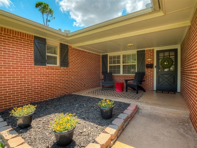 10505 Lyndon Rd, The Village, OK 73120 - property entrance with a porch and brick siding