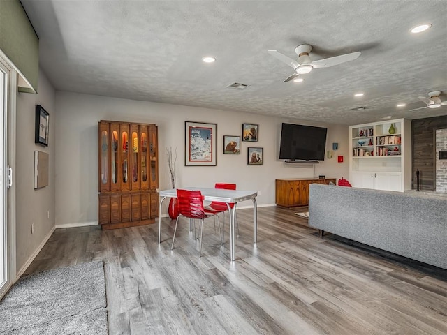 10505 Lyndon Rd, The Village, OK 73120 - living room with ceiling fan, wood finished floors, recessed lighting, and a textured ceiling