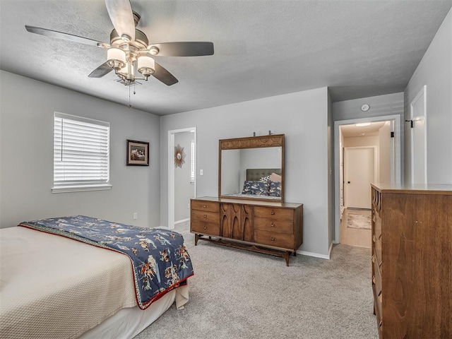 10505 Lyndon Rd, The Village, OK 73120 - carpeted bedroom with a textured ceiling and a ceiling fan