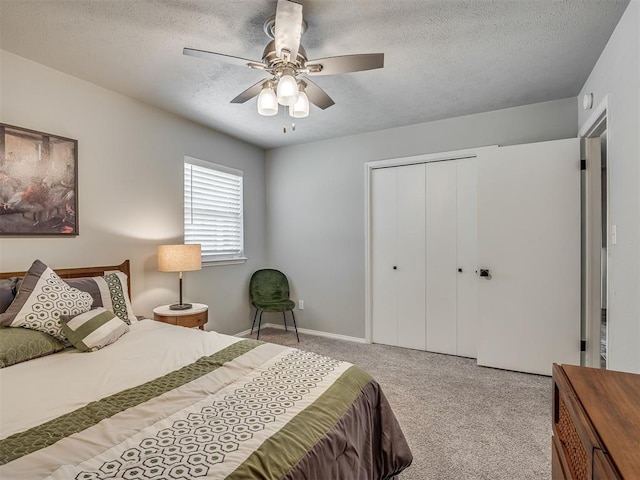 10505 Lyndon Rd, The Village, OK 73120 - bedroom with carpet floors, a textured ceiling, a closet, and a ceiling fan