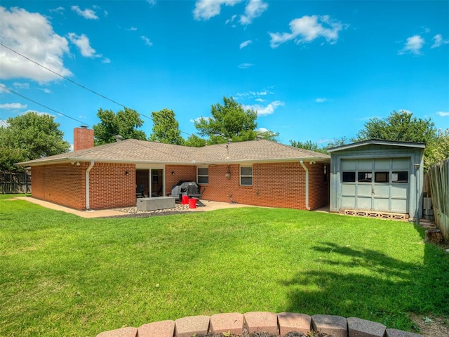 10505 Lyndon Rd, The Village, OK 73120 - back of property featuring brick siding, a chimney, a patio area, and a detached garage