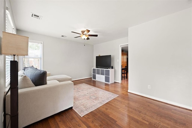 1817 Westchester Dr, Oklahoma City, OK 73120 - living area with ceiling fan and dark wood-style floors