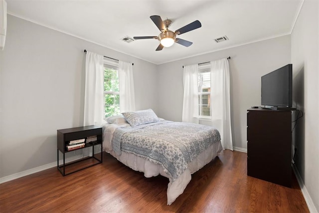 1817 Westchester Dr, Oklahoma City, OK 73120 - bedroom featuring dark wood-type flooring, ornamental molding, and a ceiling fan