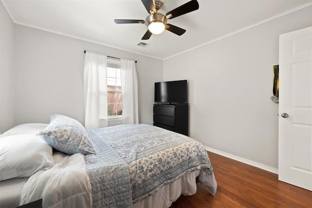 1817 Westchester Dr, Oklahoma City, OK 73120 - bedroom featuring wood finished floors, crown molding, and a ceiling fan