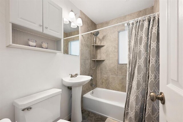 1817 Westchester Dr, Oklahoma City, OK 73120 - bathroom featuring toilet and shower / bath combination with curtain