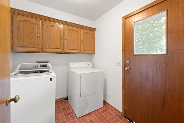 1817 Westchester Dr, Oklahoma City, OK 73120 - laundry room with washing machine and dryer, cabinet space, and brick patterned flooring