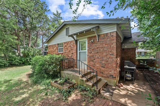 1817 Westchester Dr, Oklahoma City, OK 73120 - rear view of house featuring brick siding
