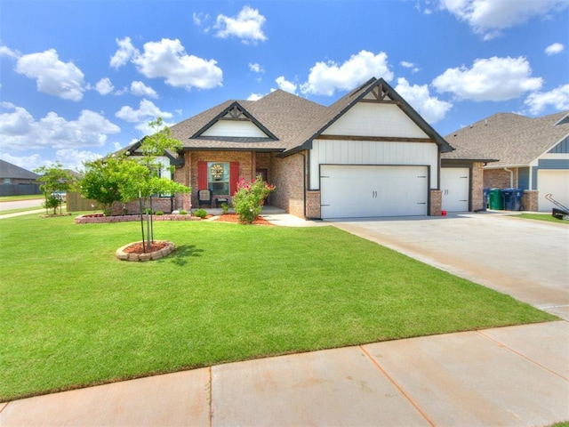 701 Bison Crossing Dr, Yukon, OK 73099 - craftsman inspired home with a garage, a front lawn, driveway, and brick siding