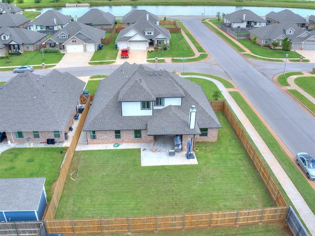 701 Bison Crossing Dr, Yukon, OK 73099 - aerial view of residential area with a nearby body of water