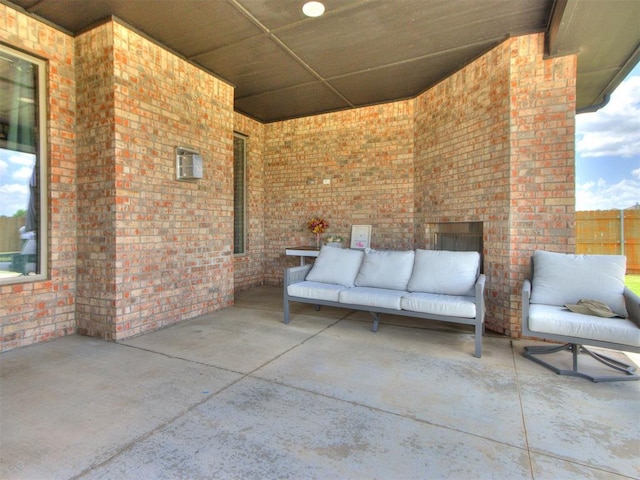 701 Bison Crossing Dr, Yukon, OK 73099 - view of patio with an outdoor living space with a fireplace