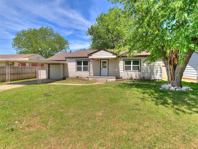 213 E Haddock St, Norman, OK 73069 - single story home with an attached garage and driveway