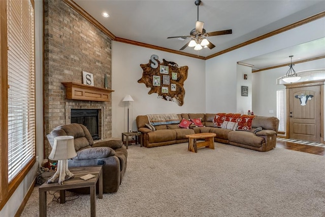 2858 Fields Rd, El Reno, OK 73036 - carpeted living area featuring a ceiling fan, crown molding, and a fireplace