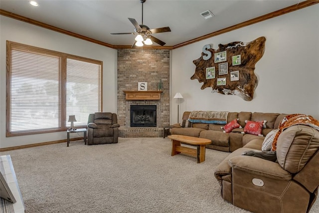 2858 Fields Rd, El Reno, OK 73036 - carpeted living area featuring a ceiling fan, crown molding, and a brick fireplace