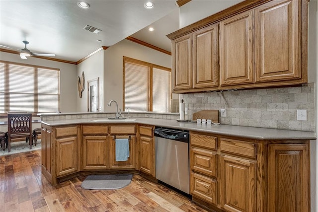 2858 Fields Rd, El Reno, OK 73036 - kitchen with dishwasher, crown molding, a peninsula, tasteful backsplash, and a ceiling fan