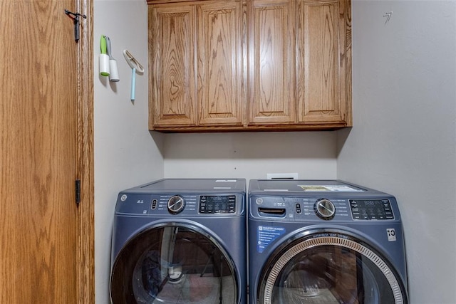 2858 Fields Rd, El Reno, OK 73036 - laundry area featuring washing machine and dryer and cabinet space