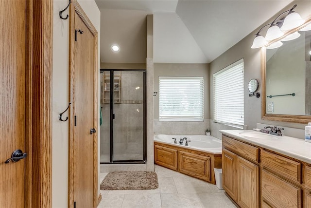 2858 Fields Rd, El Reno, OK 73036 - bathroom featuring vanity, a stall shower, a bath, vaulted ceiling, and tile patterned flooring