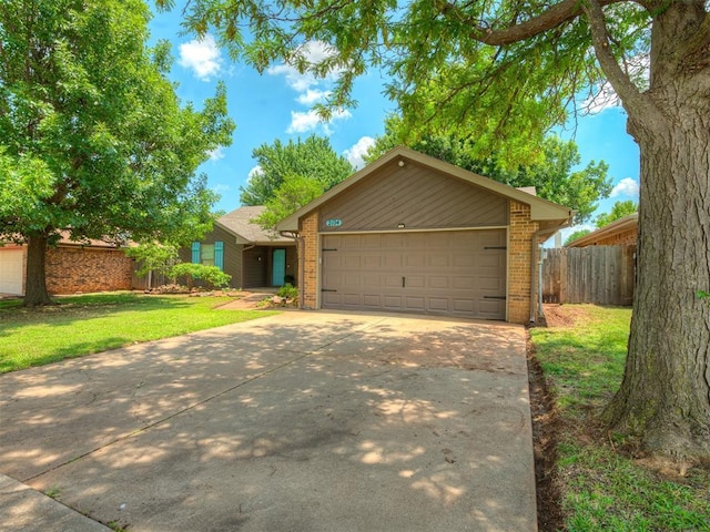 2104 Tanglewood Dr, Edmond, OK 73013 - view of front facade with brick siding, concrete driveway, and a garage