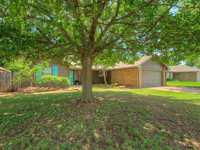 2104 Tanglewood Dr, Edmond, OK 73013 - view of front of house with an attached garage, driveway, and brick siding