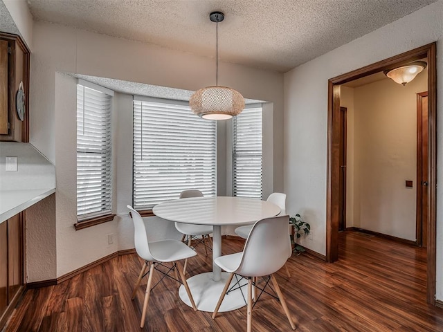 2104 Tanglewood Dr, Edmond, OK 73013 - dining area featuring a textured ceiling and wood finished floors
